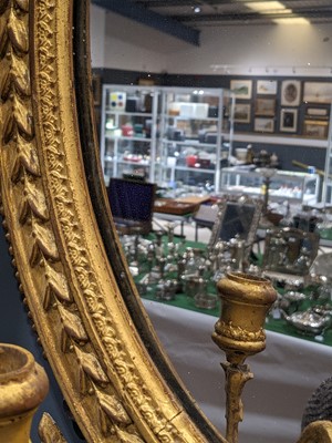 Lot 181 - A pair of George III giltwood girandole mirrors