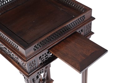 Lot 68 - A pair of modern mahogany Chippendale style urn stands