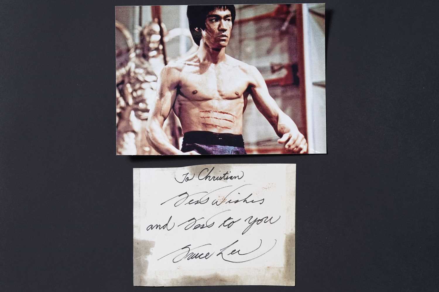 Lot 735 - A Bruce Lee signed and inscribed paper