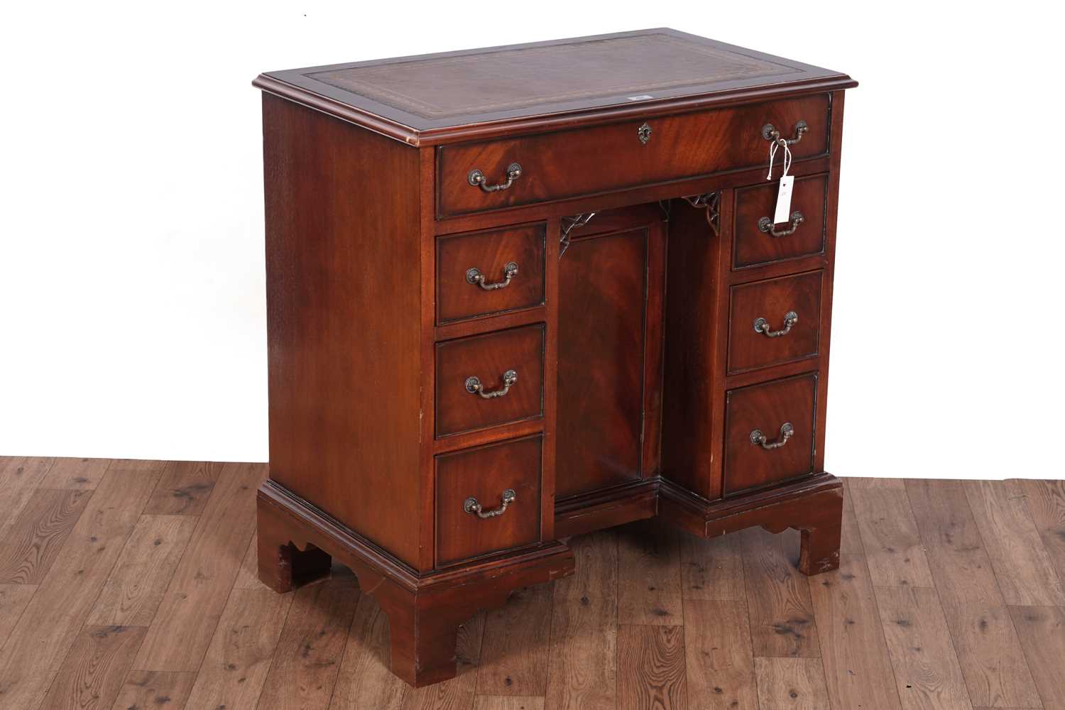 Lot 461 - A substantial Georgian style mahogany kneehole desk