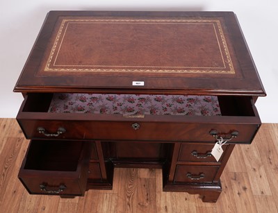 Lot 461 - A substantial Georgian style mahogany kneehole desk
