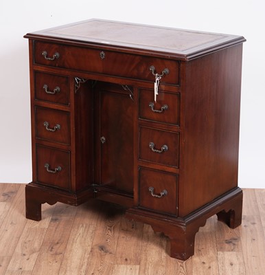Lot 461 - A substantial Georgian style mahogany kneehole desk