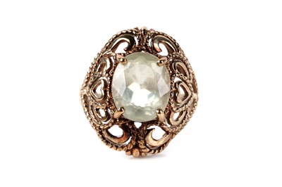 Lot 121 - A yellow gemstone set single stone ring