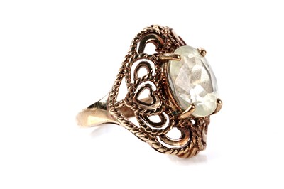 Lot 121 - A yellow gemstone set single stone ring