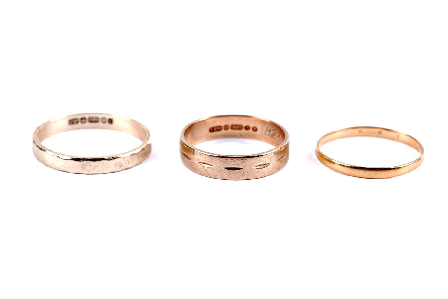 Lot 18 - Two 9ct yellow gold wedding bands; and another yellow gold wedding ring