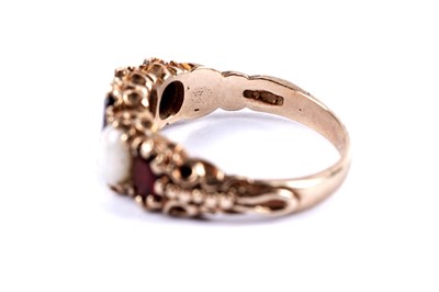 Lot 49 - An opal and garnet five stone ring