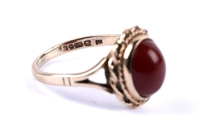 Lot 79 - A carnelian cabochon ring