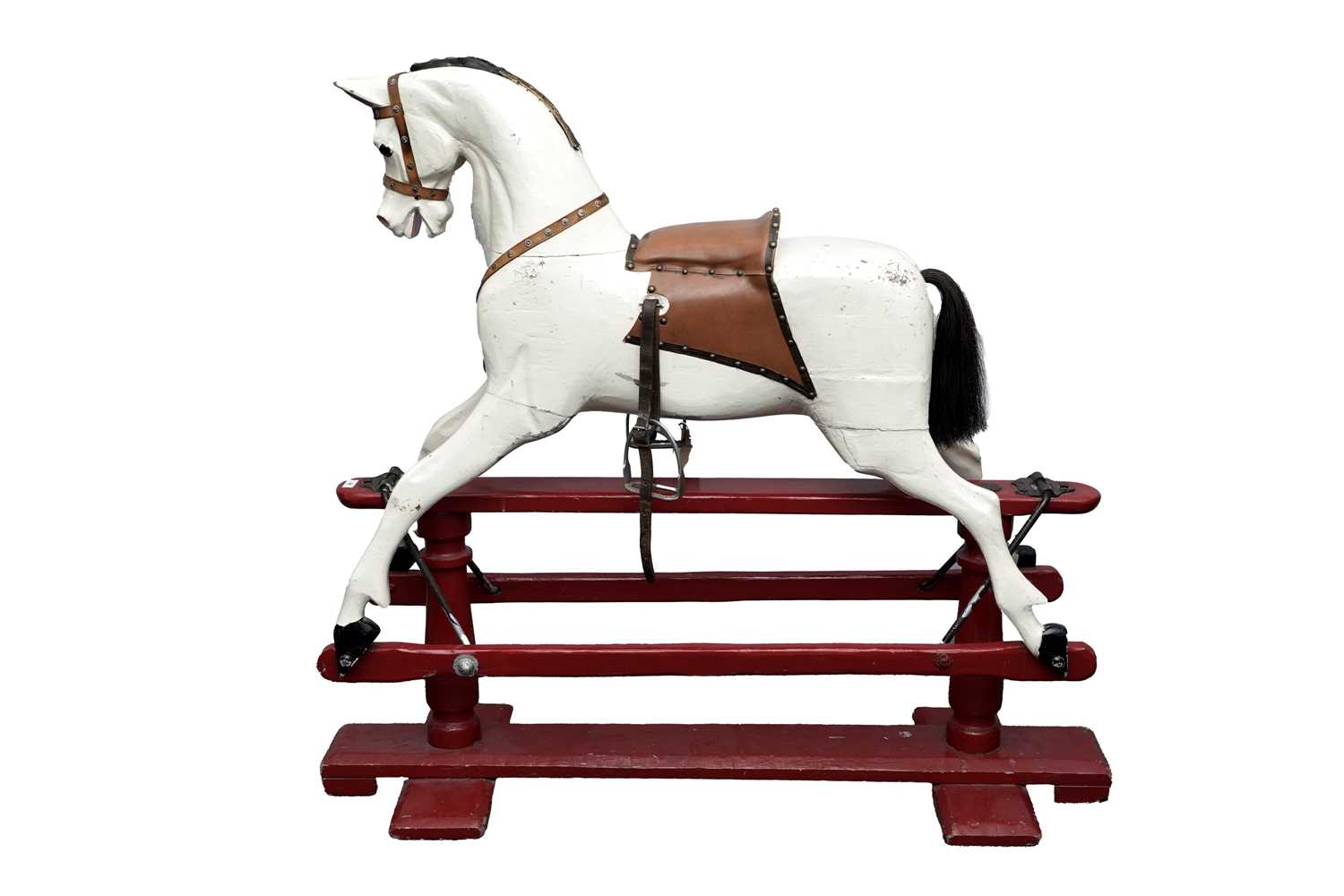 Lot 34 - A vintage white painted carved wooden rocking horse