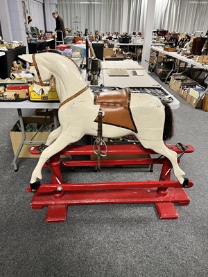 Lot 34 - A vintage white painted carved wooden rocking horse