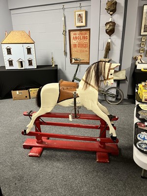 Lot 34 - A vintage white painted carved wooden rocking horse
