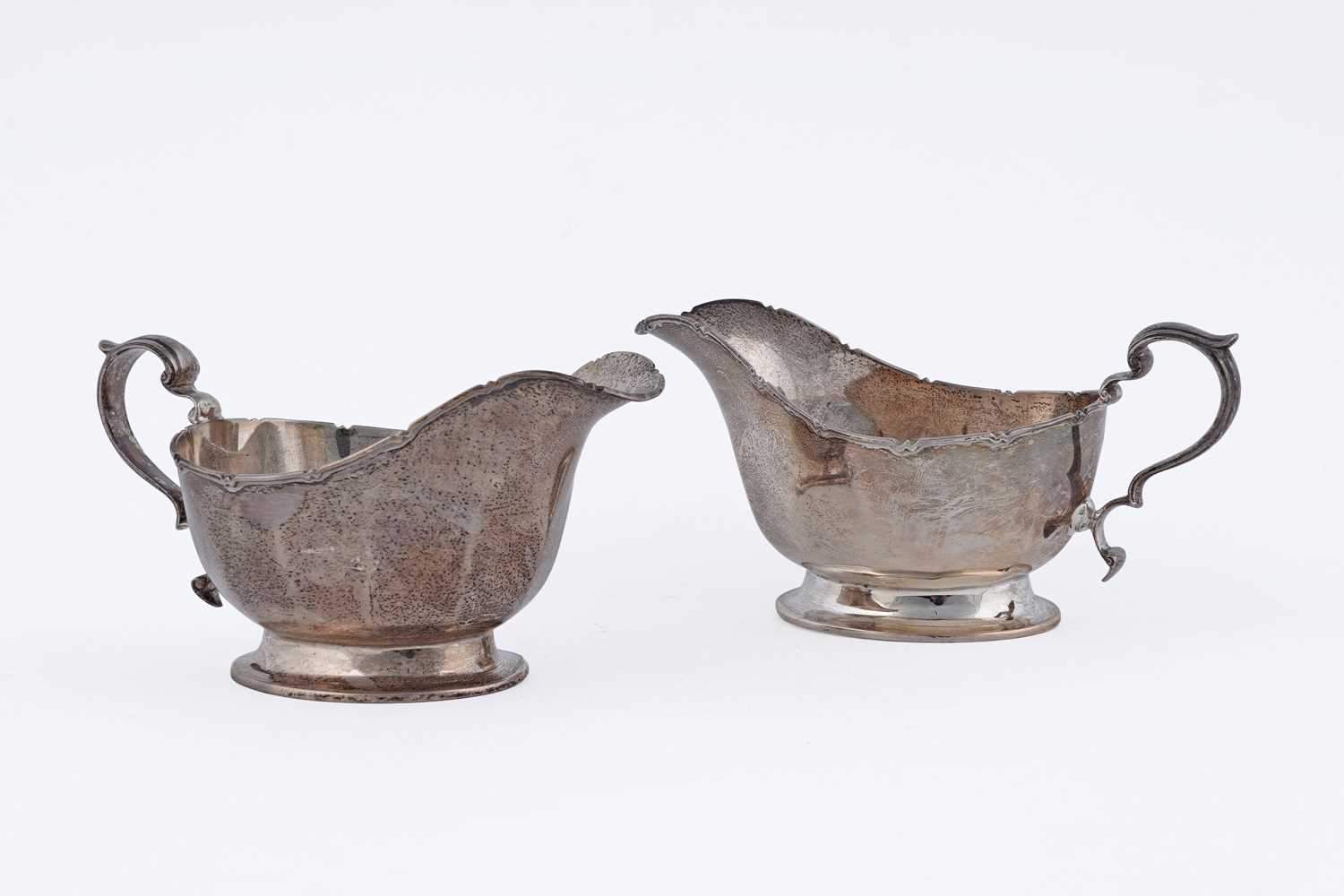 Lot 18 - A pair of George VI silver sauceboats
