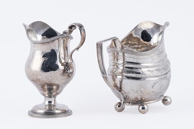 Lot 83 - Two George III silver cream jugs