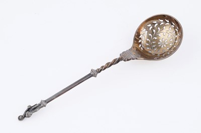 Lot 10 - A Victorian cased pair of silver parcel-gilt fruit serving spoons and matching sugar sifter spoon