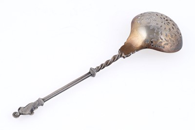 Lot 10 - A Victorian cased pair of silver parcel-gilt fruit serving spoons and matching sugar sifter spoon