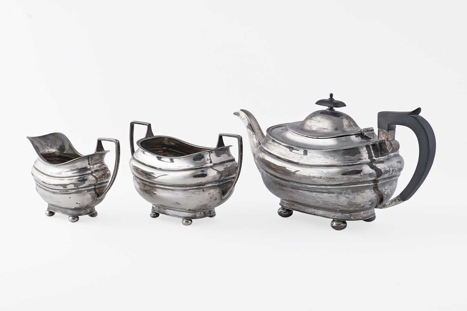 Lot 20 - A George VI silver three-piece tea set