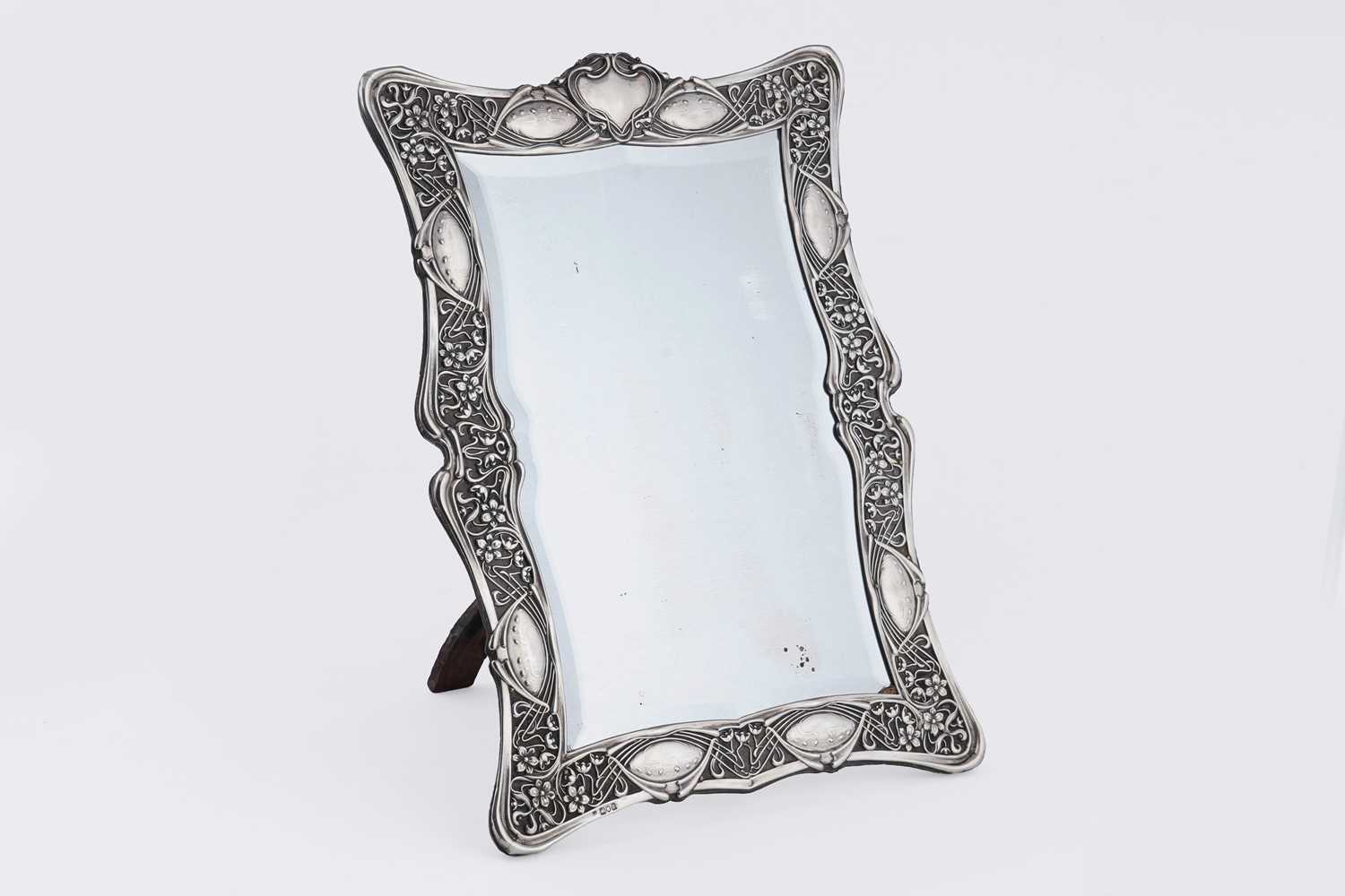 Lot 48 - An Edwardian silver dressing table mirror