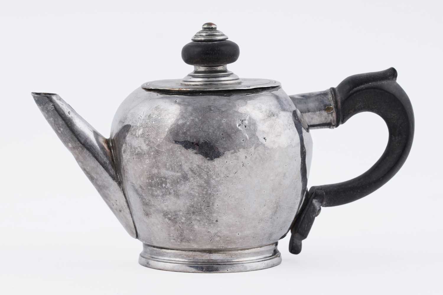 Lot 73 - A rare George I/II West Country silver miniature or herb teapot