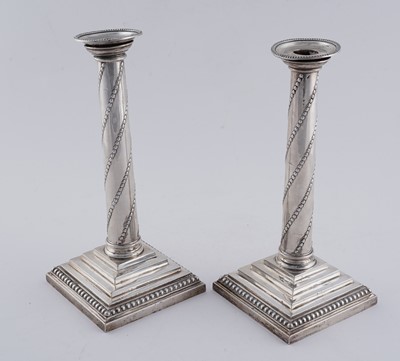 Lot 104 - A pair of late Victorian silver candlesticks