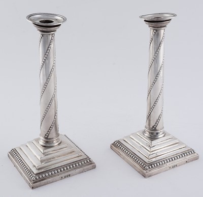 Lot 104 - A pair of late Victorian silver candlesticks