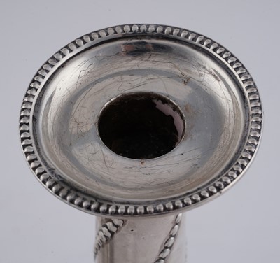 Lot 104 - A pair of late Victorian silver candlesticks