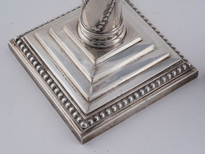Lot 104 - A pair of late Victorian silver candlesticks