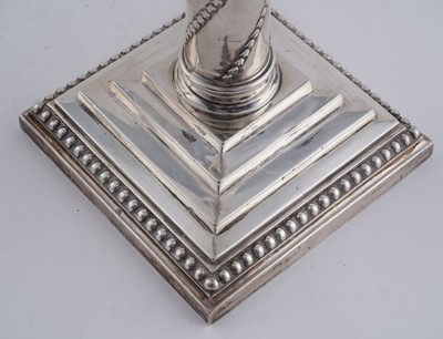 Lot 104 - A pair of late Victorian silver candlesticks