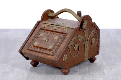 Lot 202 - An Arts and Crafts oak coal scuttle