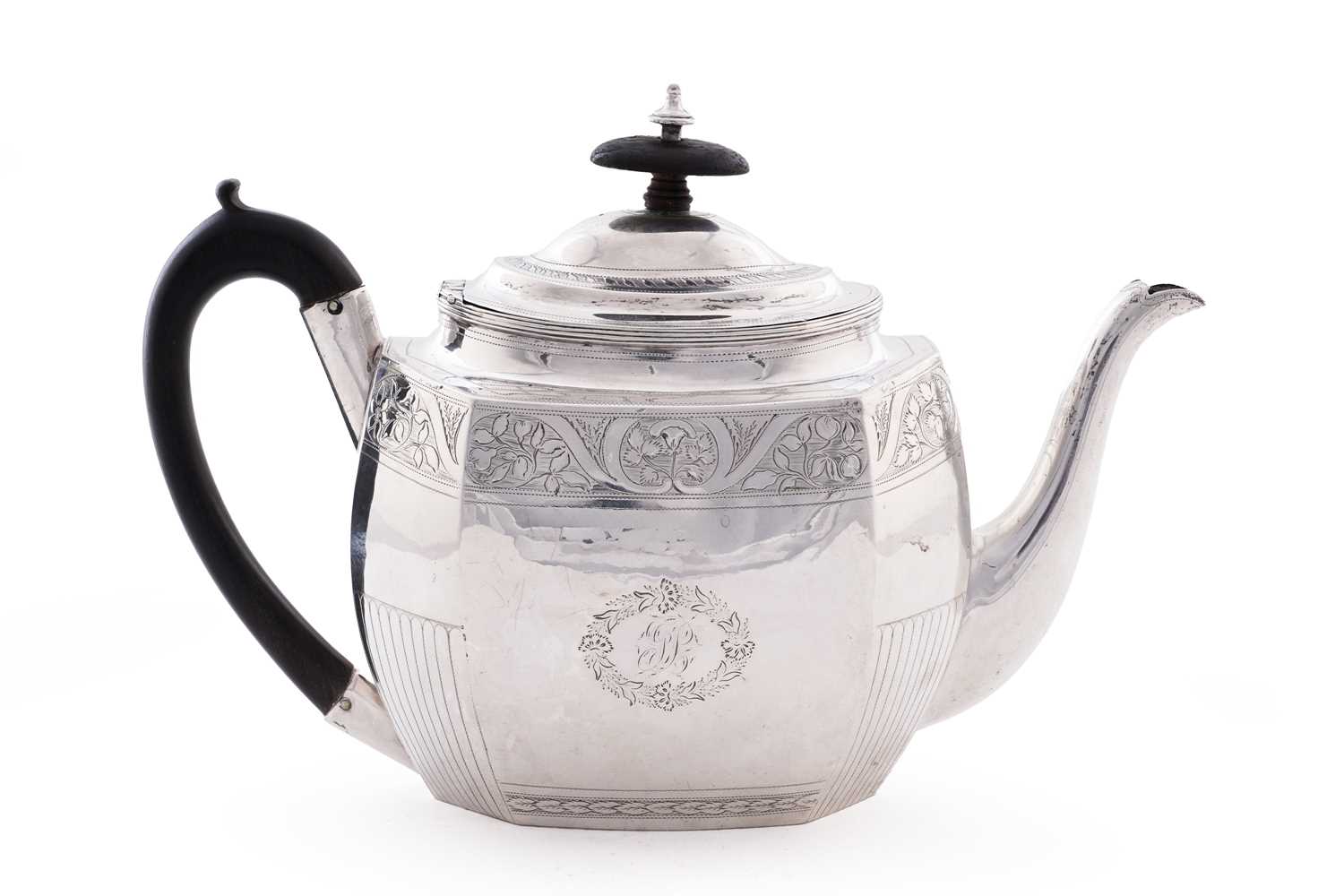 Lot 105 - A George III silver teapot of shaped octagonal form