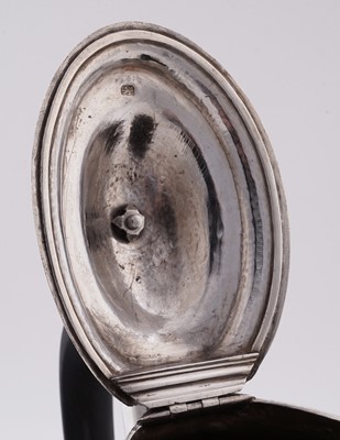 Lot 105 - A George III silver teapot of shaped octagonal form