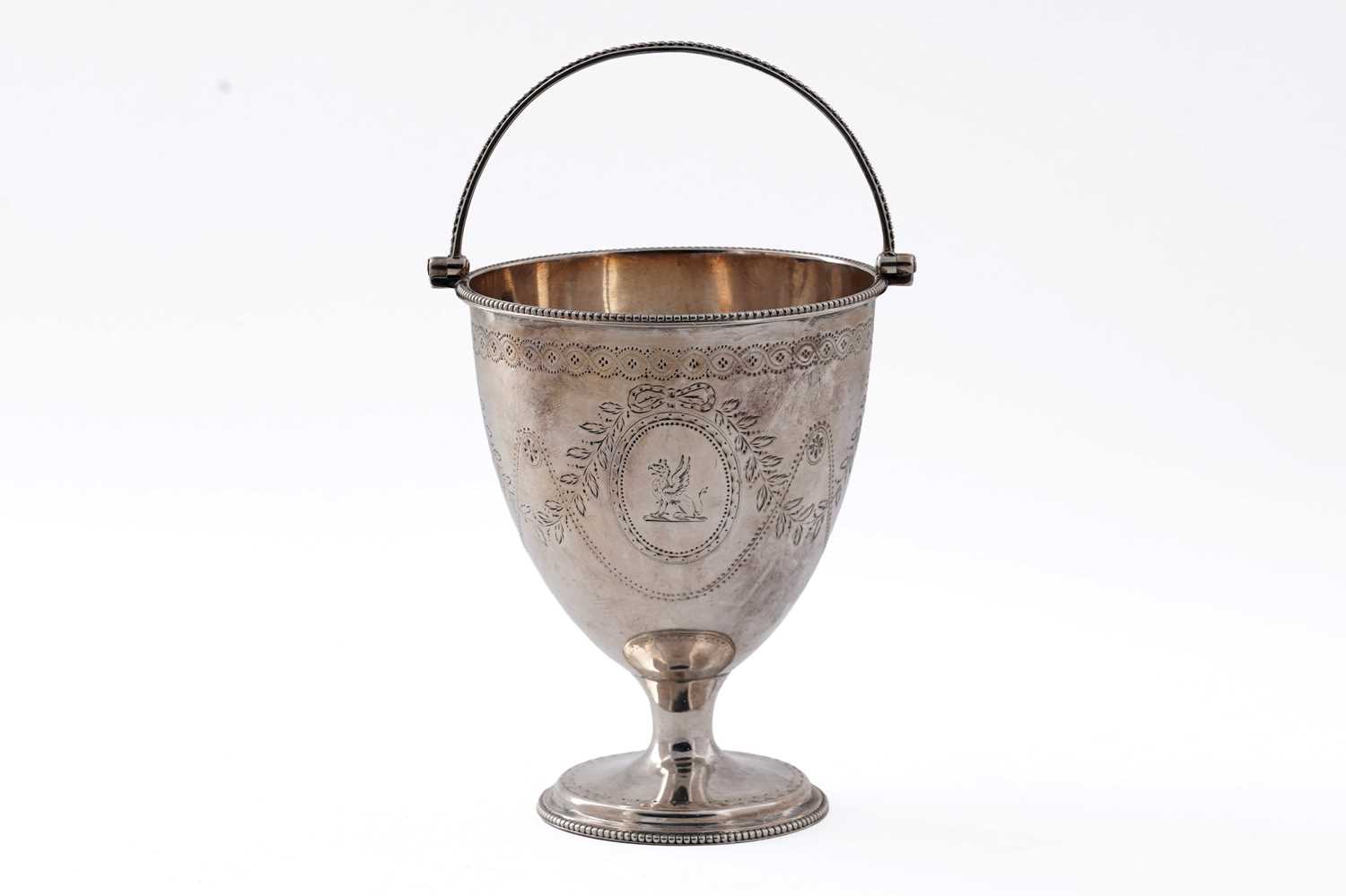 Lot 38 - A George III Silver swing handled sugar antique vase