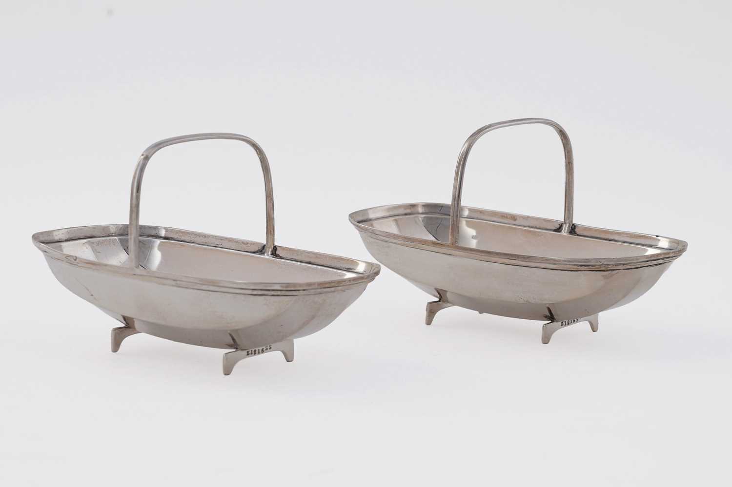 Lot 107 - A pair of George V silver novelty bonbon dishes
