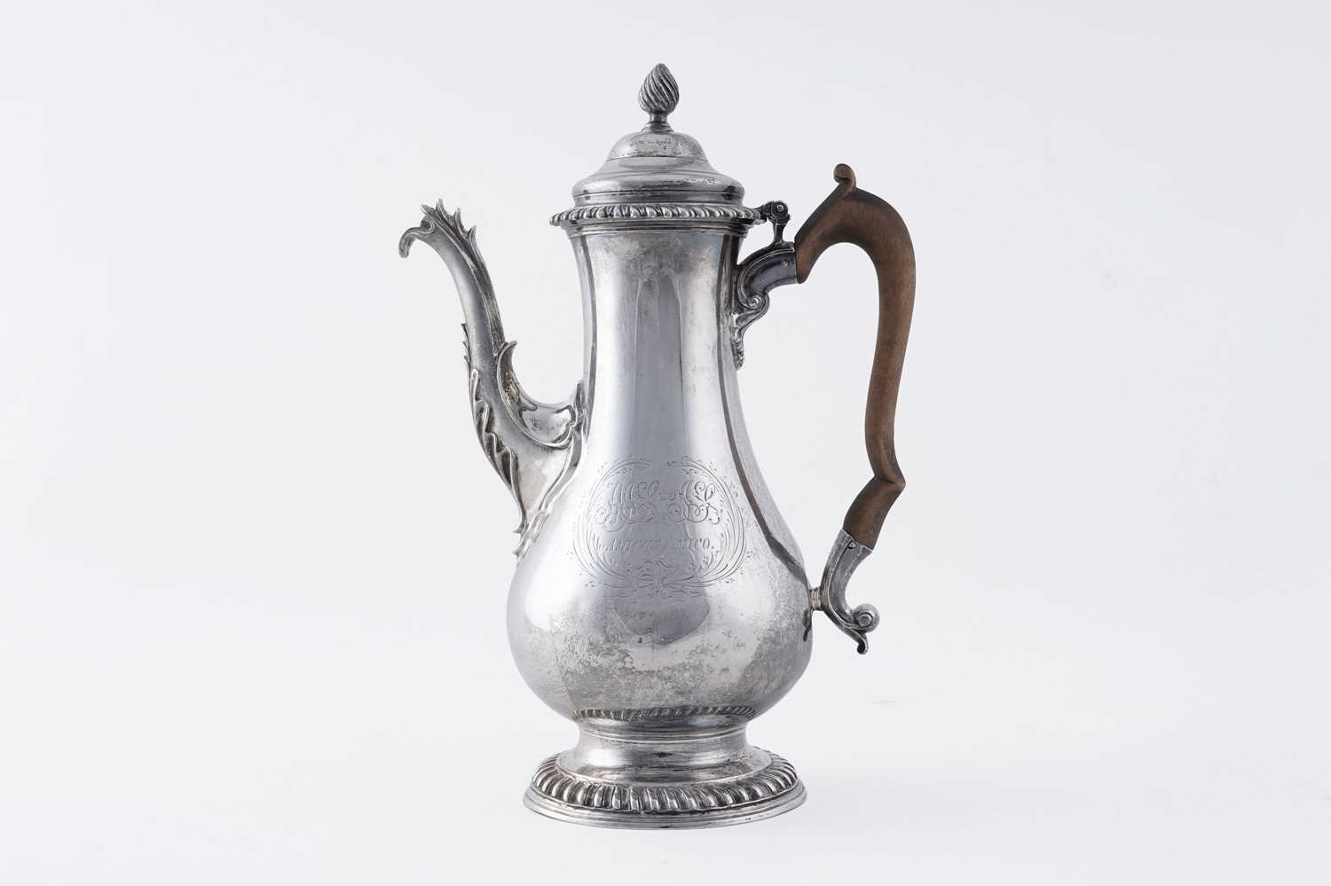 Lot 84 - An early George III silver coffee pot of baluster form