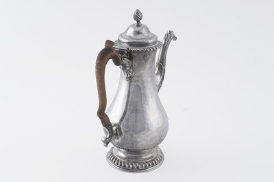 Lot 84 - An early George III silver coffee pot of baluster form