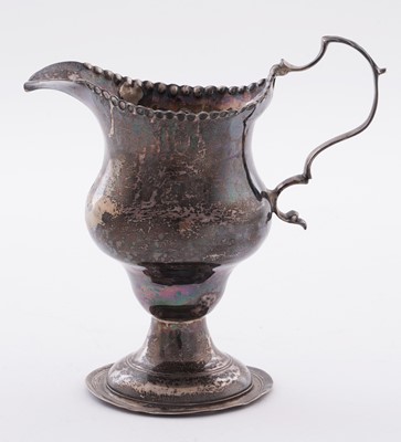 Lot 110 - A George III silver cream jug