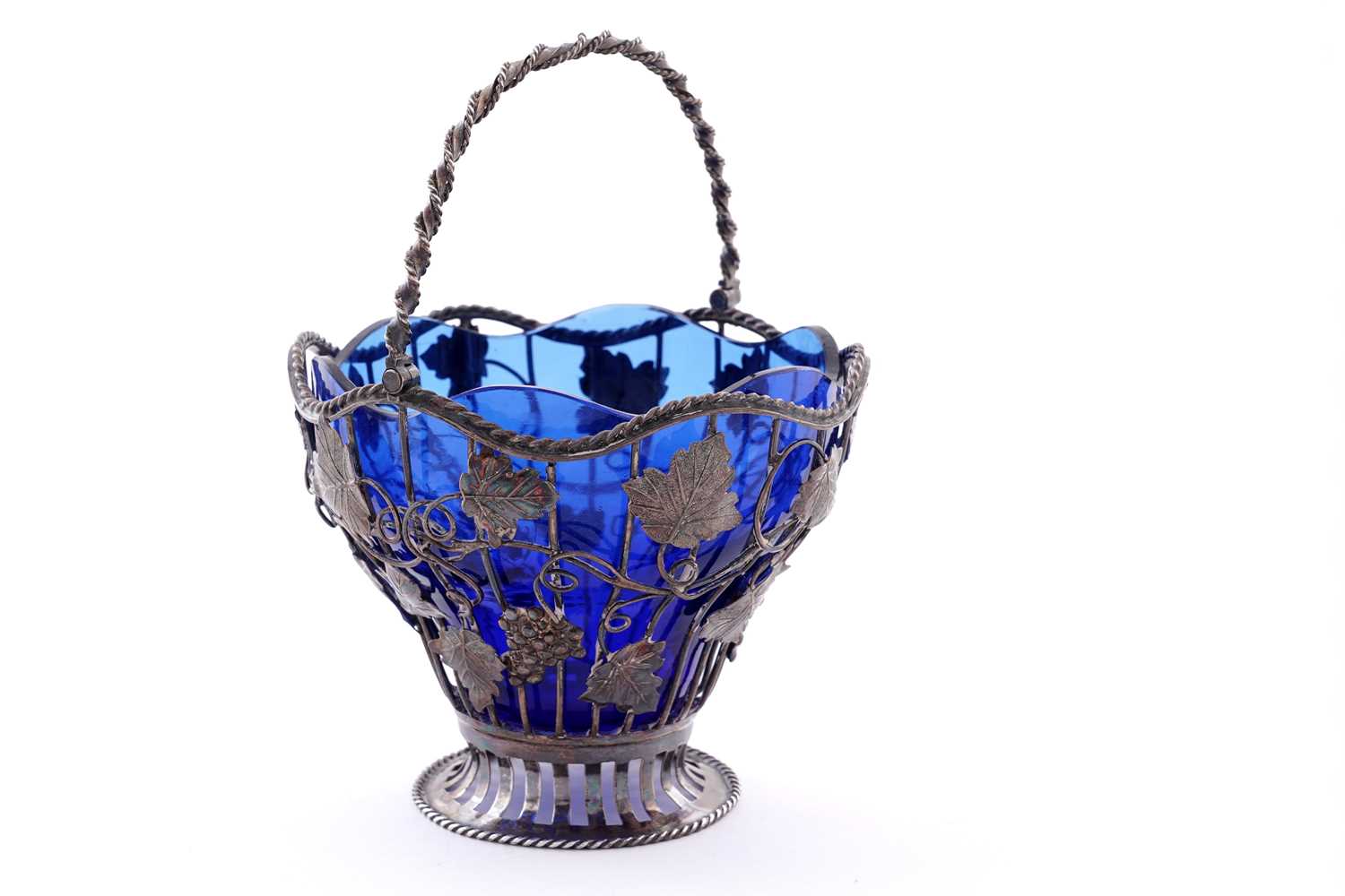 Lot 111 - A George III silver wirework sugar basket