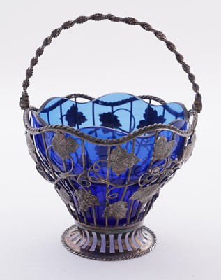 Lot 111 - A George III silver wirework sugar basket