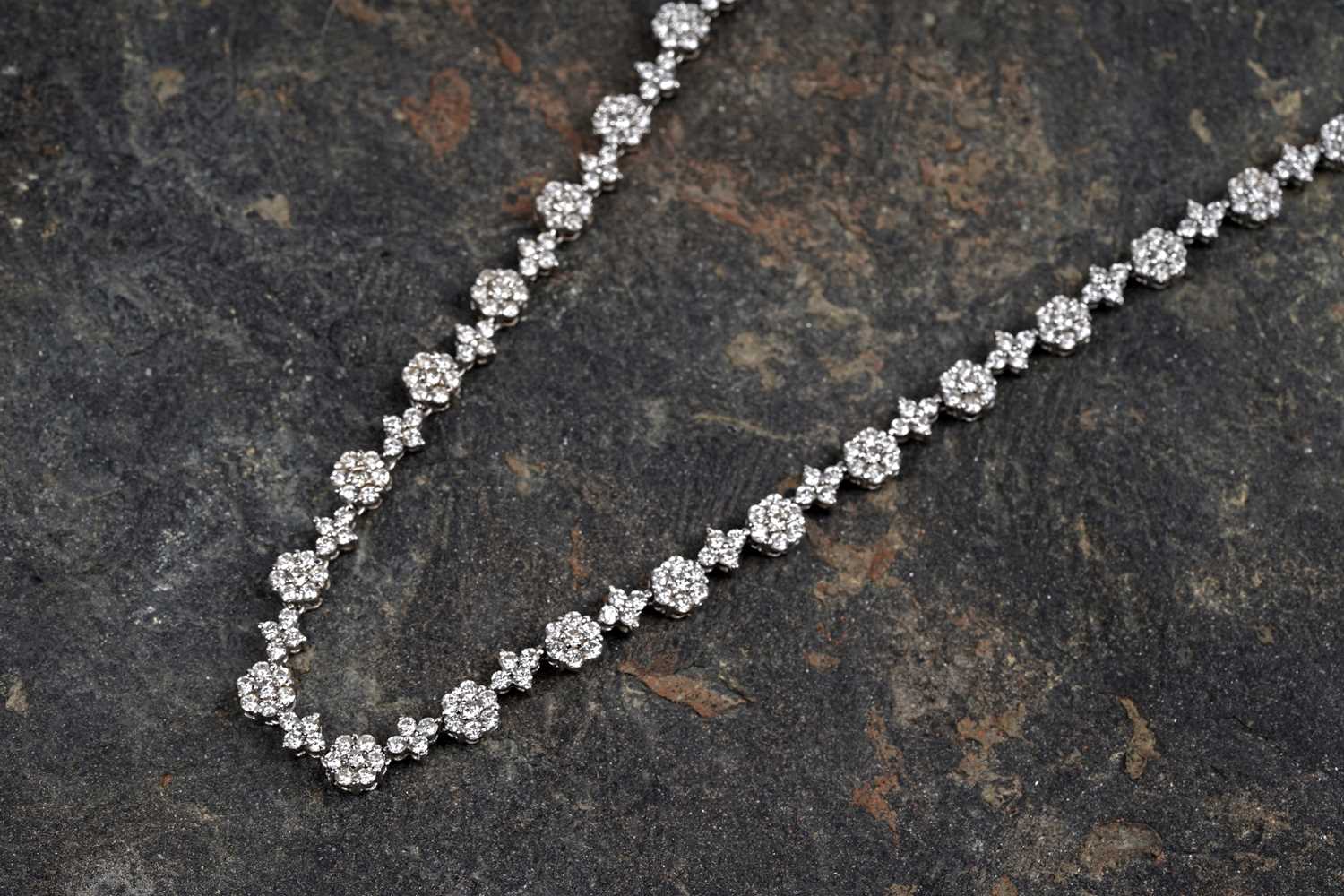 Lot 540 - A diamond line necklace