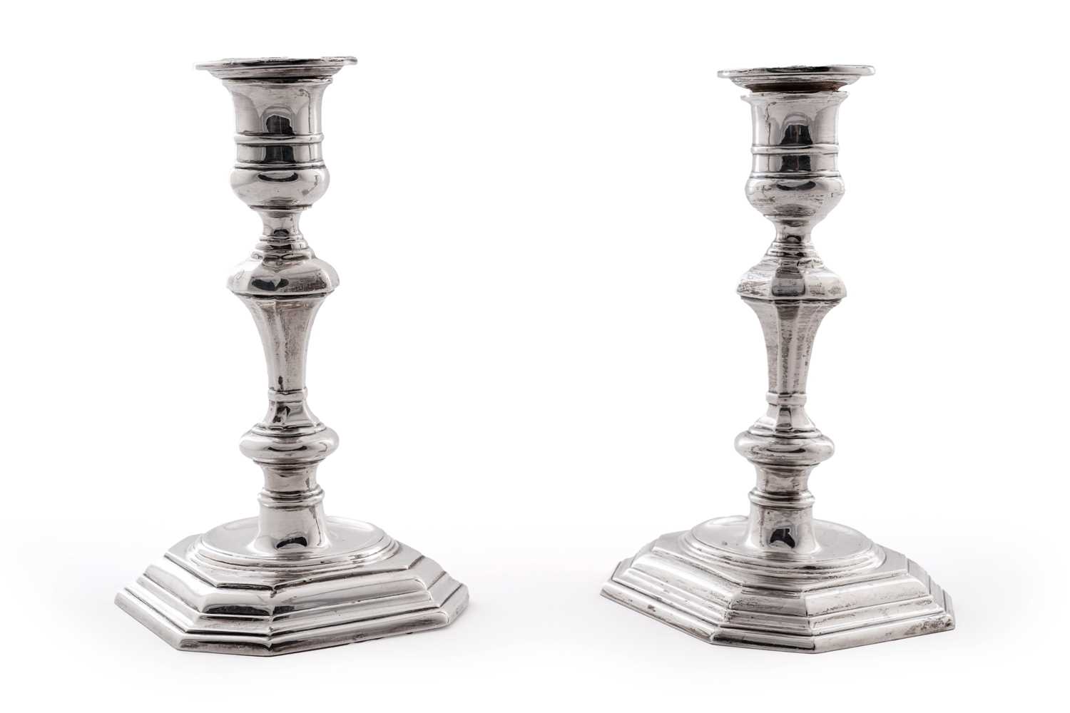 Lot 5 - A pair of George V silver candlesticks