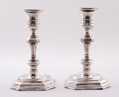 Lot 5 - A pair of George V silver candlesticks