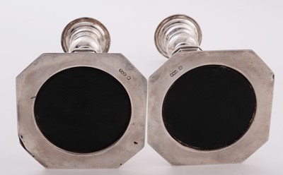 Lot 5 - A pair of George V silver candlesticks
