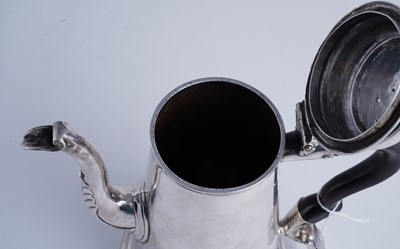Lot 80 - A George II silver coffee pot of tapering form on a skirted base