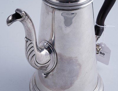 Lot 80 - A George II silver coffee pot of tapering form on a skirted base