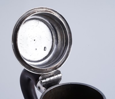 Lot 80 - A George II silver coffee pot of tapering form on a skirted base