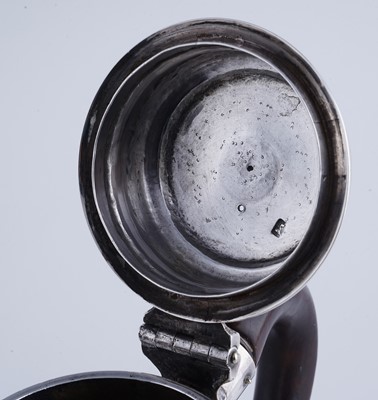 Lot 80 - A George II silver coffee pot of tapering form on a skirted base