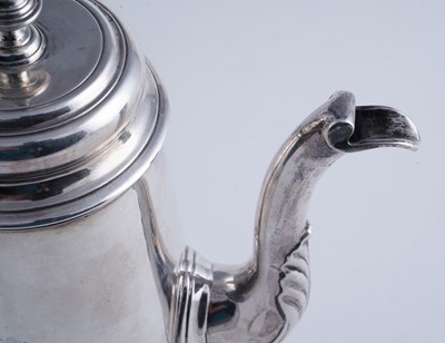 Lot 80 - A George II silver coffee pot of tapering form on a skirted base