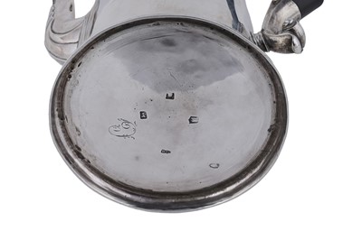 Lot 80 - A George II silver coffee pot of tapering form on a skirted base