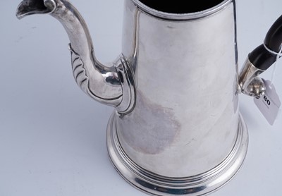 Lot 80 - A George II silver coffee pot of tapering form on a skirted base