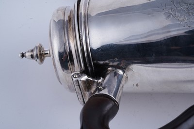 Lot 80 - A George II silver coffee pot of tapering form on a skirted base