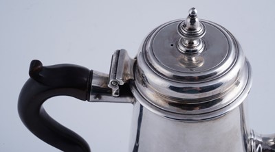 Lot 80 - A George II silver coffee pot of tapering form on a skirted base
