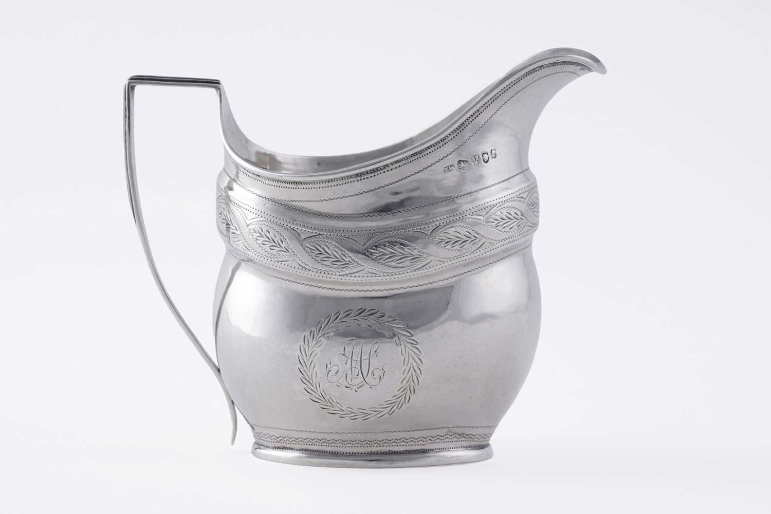 Lot 65 - A George III silver cream jug